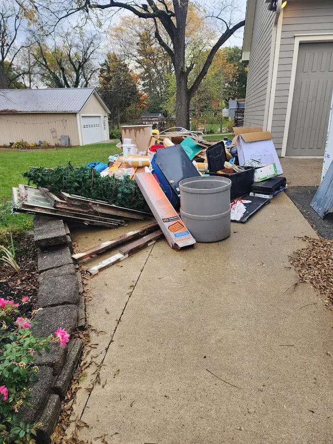 Dumpster being loaded with debris for 3 Yard Dumpster Rental in Glenn Dale